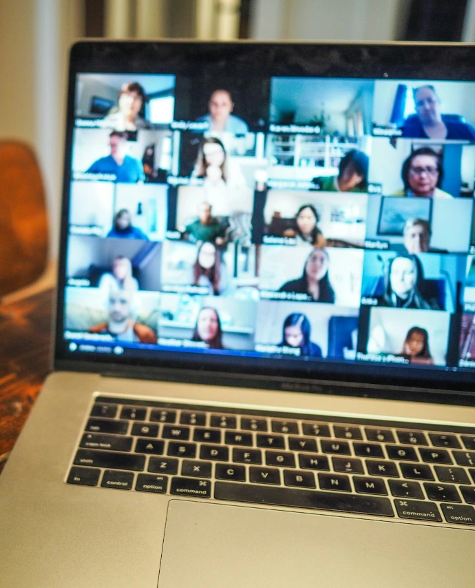 macbook pro displaying group of people